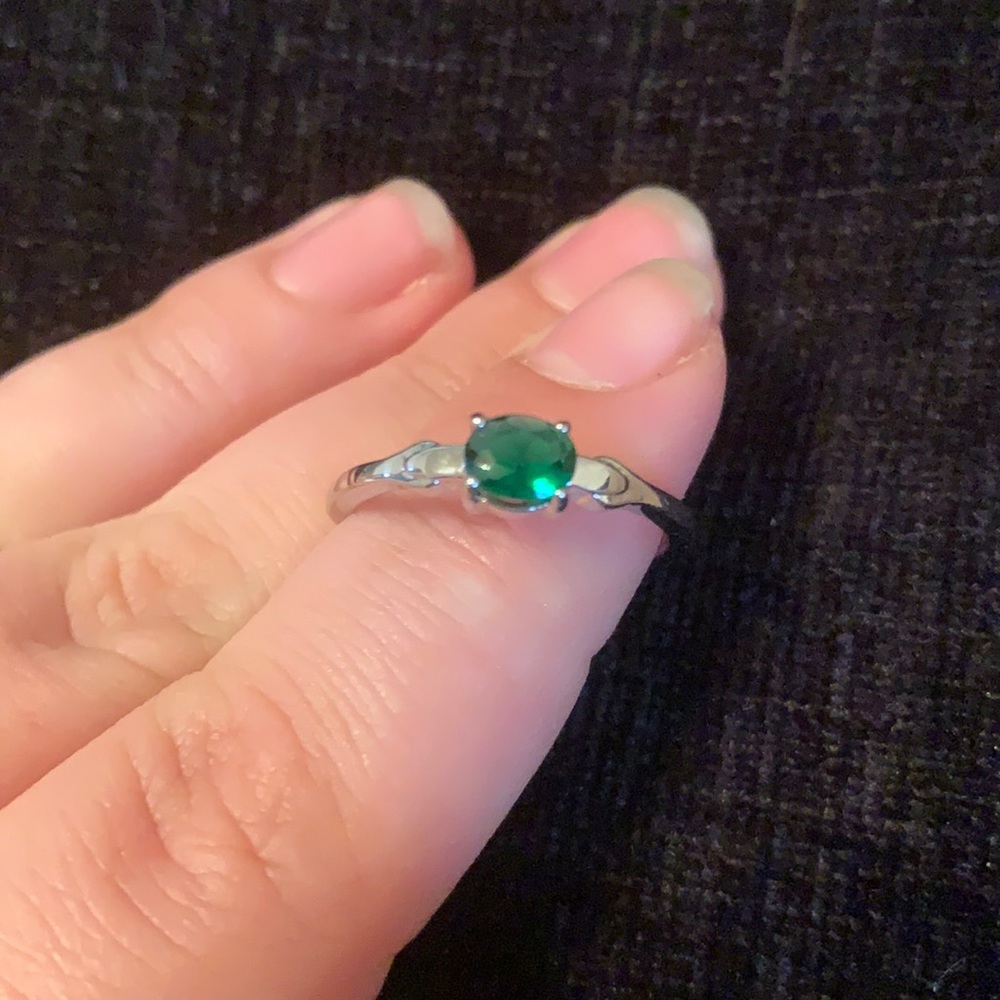 White metal band with green stone